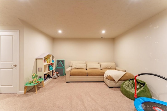 recreation room featuring light carpet