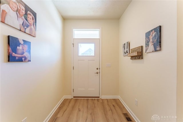 doorway featuring light hardwood / wood-style flooring