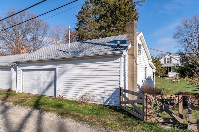 view of side of home featuring a garage