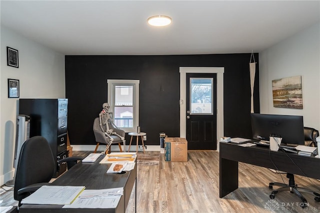 home office with wood-type flooring