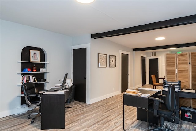 office with beamed ceiling and light wood-type flooring