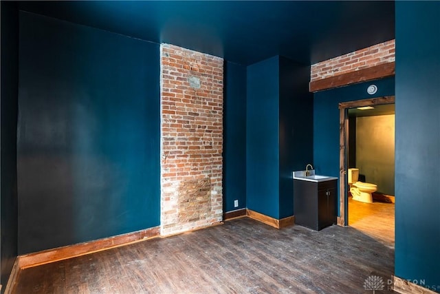 interior space featuring sink and dark hardwood / wood-style floors