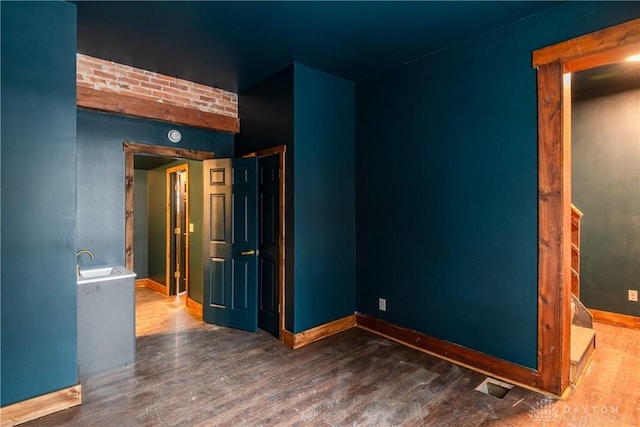 spare room with dark wood-type flooring