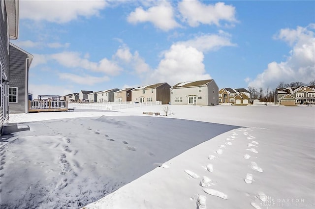 view of yard layered in snow