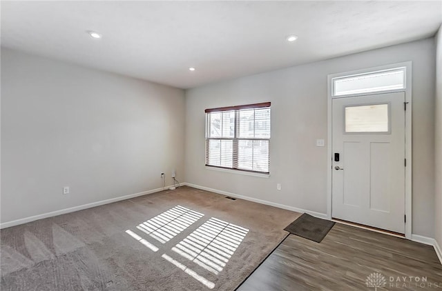 entrance foyer featuring carpet