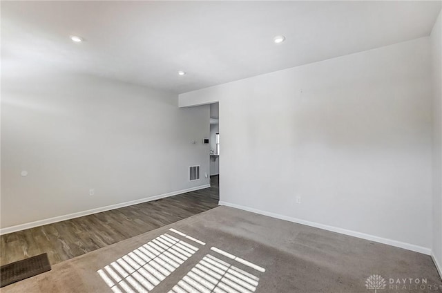 empty room with dark wood-type flooring