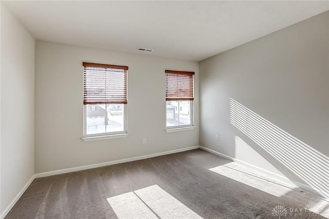 spare room featuring carpet flooring