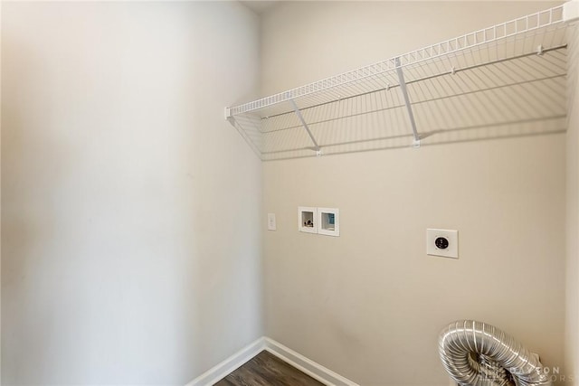 washroom featuring hookup for a washing machine, dark wood-type flooring, and hookup for an electric dryer