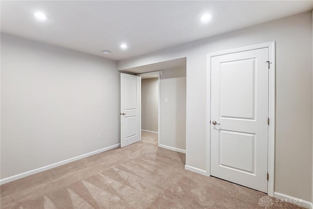 unfurnished bedroom featuring light colored carpet