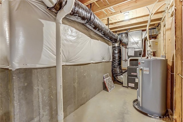 utility room featuring water heater