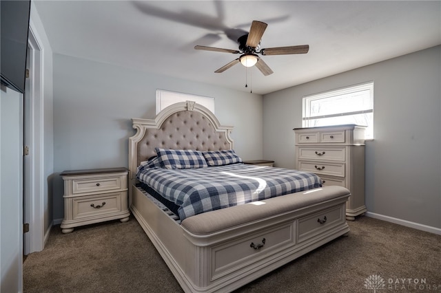 bedroom with dark carpet and ceiling fan