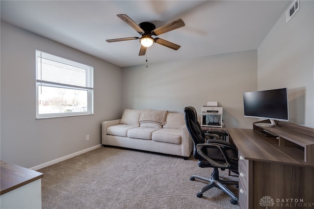 home office featuring ceiling fan and light colored carpet