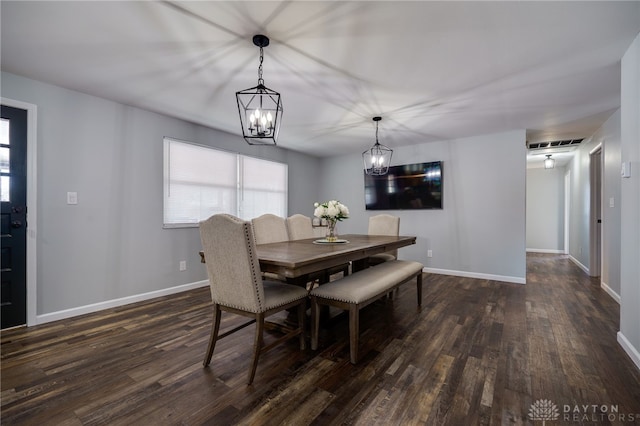 dining space featuring dark wood-type flooring