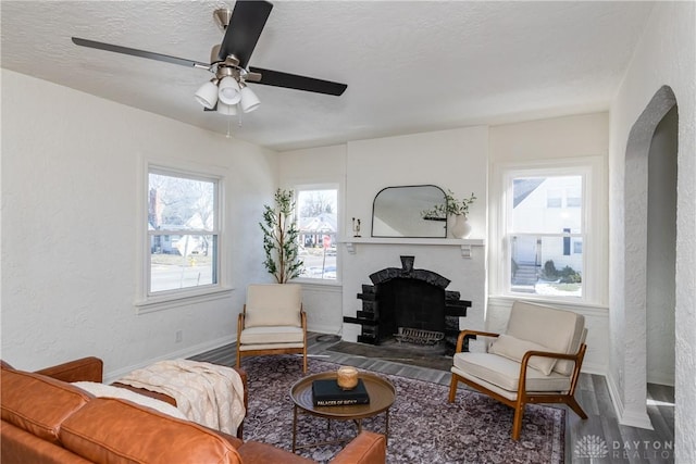 living room with plenty of natural light, hardwood / wood-style floors, and a textured ceiling