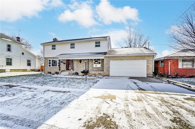 front of property with a garage