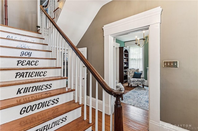 1311 US Route 50, Miami Township, OH 45150 - stairway featuring wood finished floors, a chandelier, and vaulted ceiling