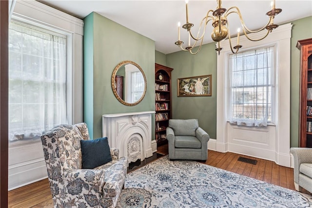 1311 US Route 50, Miami Township, OH 45150 - living area with hardwood / wood-style floors, a chandelier, and baseboards
