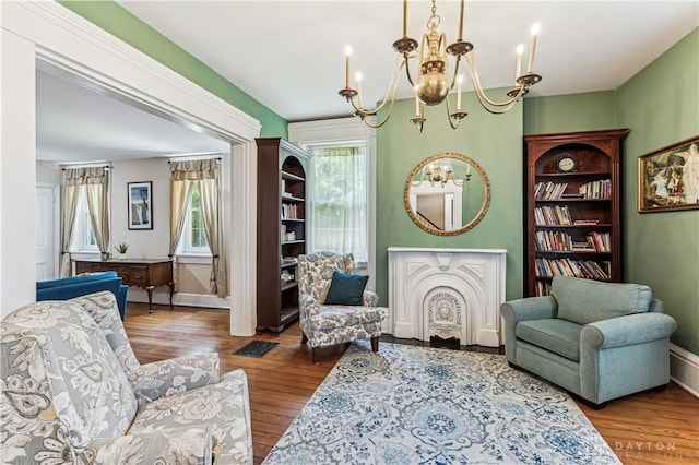 1311 US Route 50, Miami Township, OH 45150 - sitting room featuring a chandelier, healthy amount of natural light, wood finished floors, and baseboards