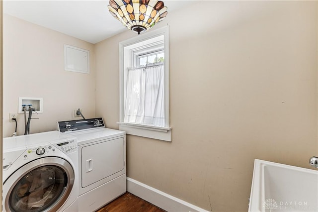 1311 US Route 50, Miami Township, OH 45150 - washroom featuring washing machine and clothes dryer, baseboards, and dark wood finished floors