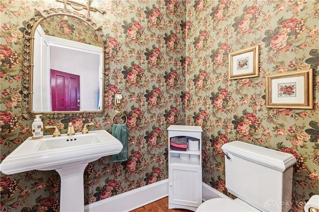 1311 US Route 50, Miami Township, OH 45150 - bathroom featuring wood finished floors, toilet, wallpapered walls, and baseboards