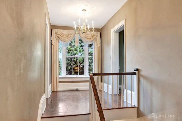 1311 US Route 50, Miami Township, OH 45150 - stairs with a chandelier, baseboards, and wood finished floors