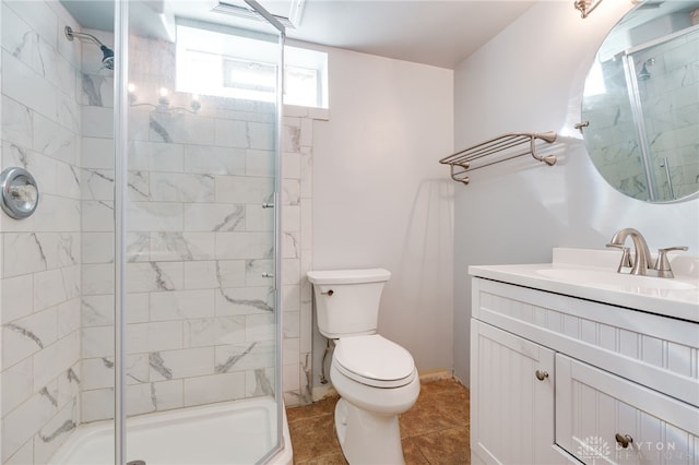 bathroom featuring vanity, toilet, a shower with shower door, and tile patterned flooring