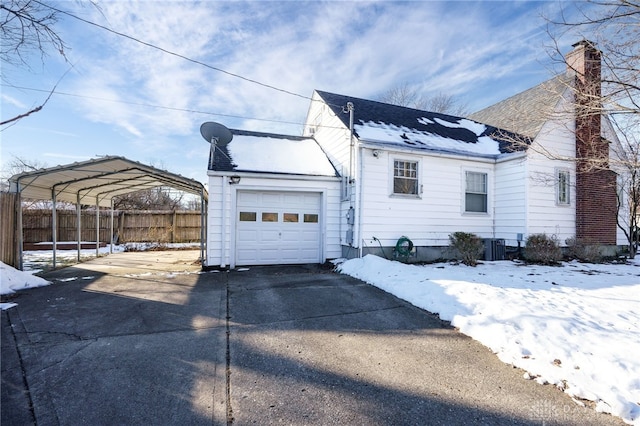 exterior space featuring a carport and a garage