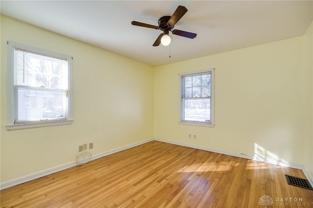 unfurnished room featuring ceiling fan and light wood-type flooring