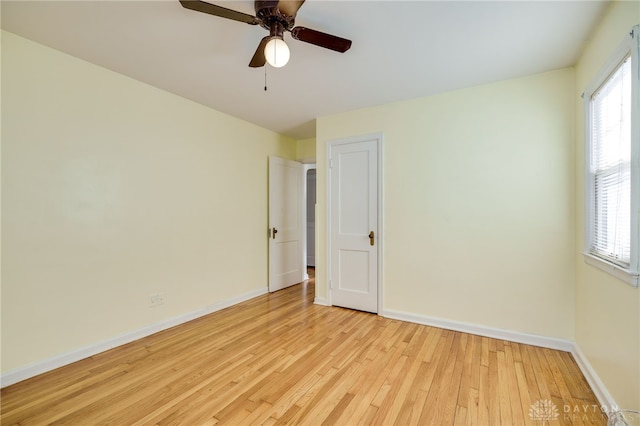 unfurnished room featuring ceiling fan and light hardwood / wood-style floors