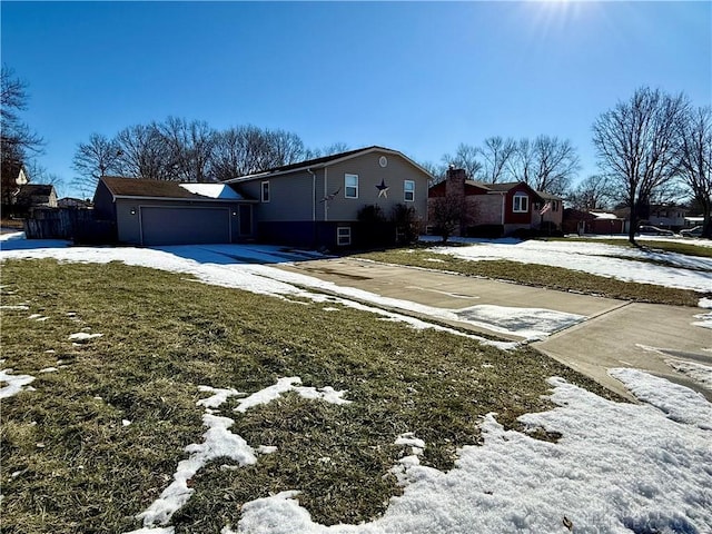 exterior space with a garage and a yard