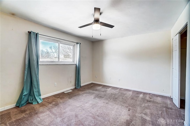 unfurnished bedroom with ceiling fan and carpet