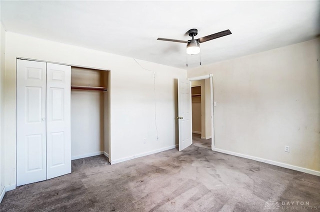 unfurnished bedroom featuring a closet, ceiling fan, and carpet