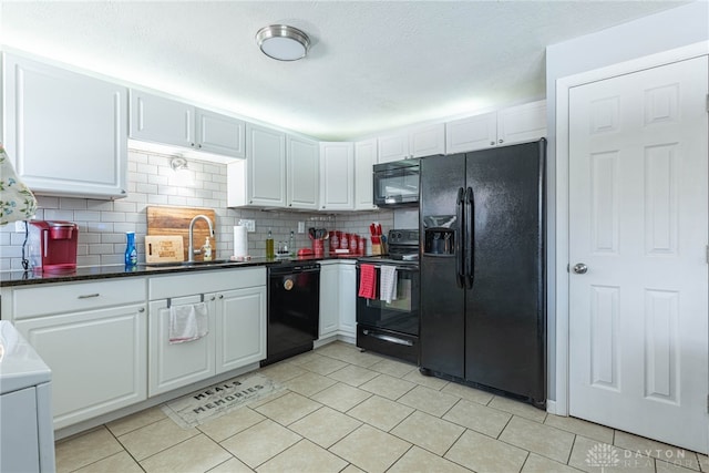 kitchen featuring sink, backsplash, black appliances, and white cabinets