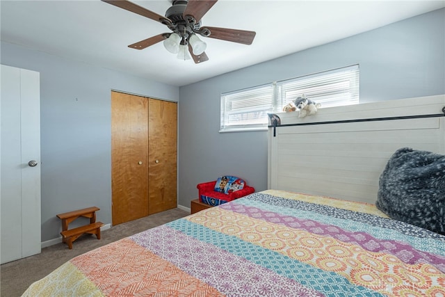 carpeted bedroom featuring ceiling fan and a closet