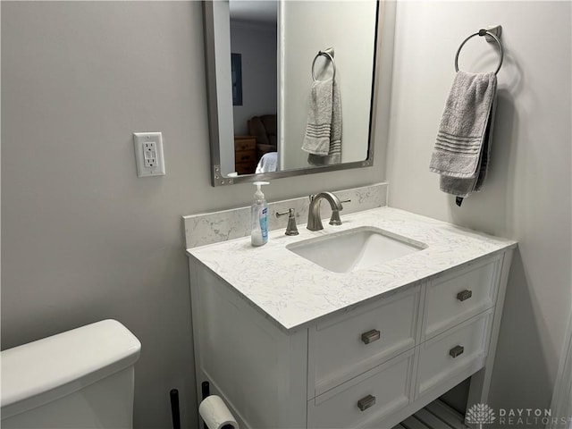 bathroom with vanity and toilet