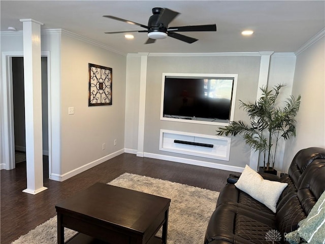 living room with ornate columns, crown molding, ceiling fan, and dark hardwood / wood-style flooring