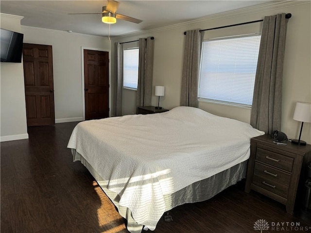 bedroom with crown molding, ceiling fan, and dark hardwood / wood-style flooring