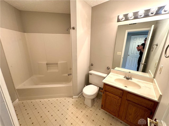 full bathroom with vanity, bathtub / shower combination, a textured ceiling, and toilet