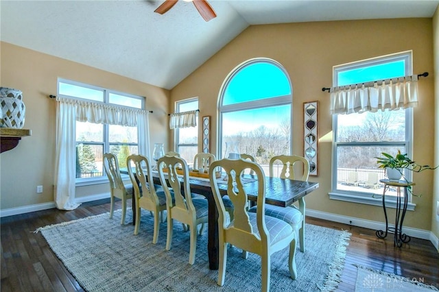 dining area featuring vaulted ceiling, dark hardwood / wood-style floors, and ceiling fan