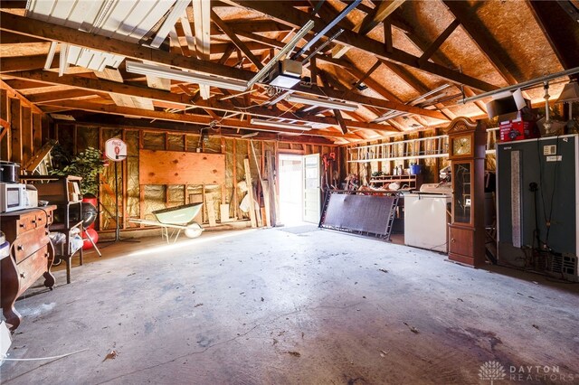 garage with fridge and a garage door opener