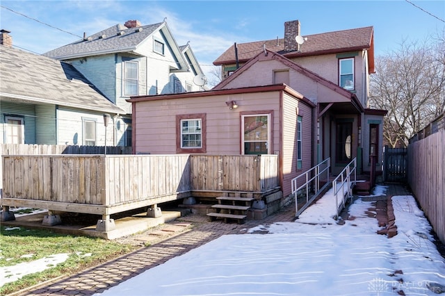 back of house featuring a wooden deck