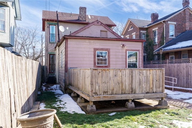 rear view of house with central air condition unit