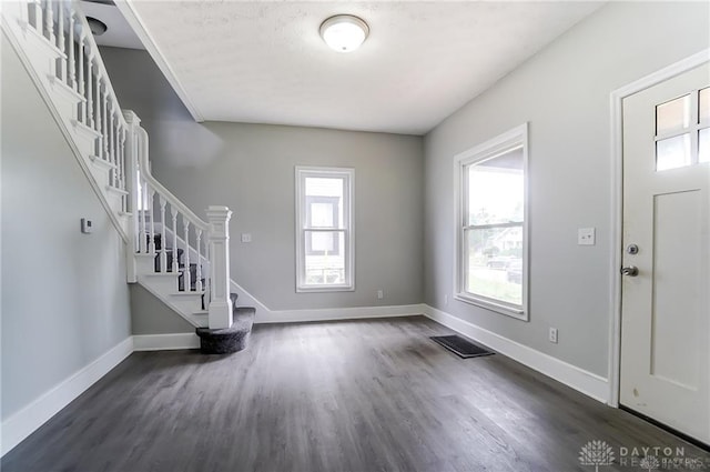 foyer with dark hardwood / wood-style floors