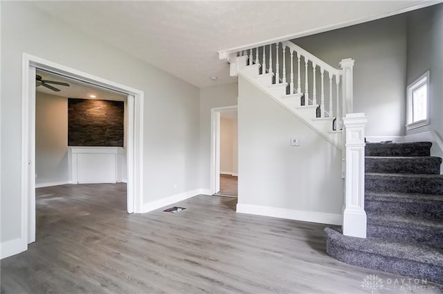 stairway featuring hardwood / wood-style floors