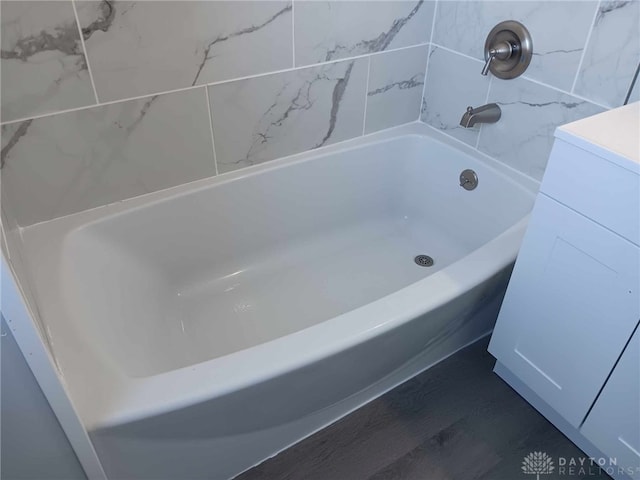 bathroom featuring a bath and wood-type flooring