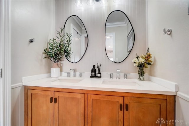 bathroom featuring vanity and crown molding