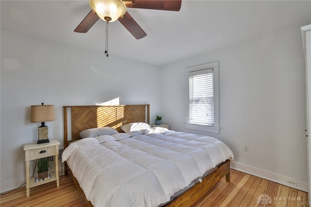 bedroom featuring ceiling fan and light hardwood / wood-style flooring