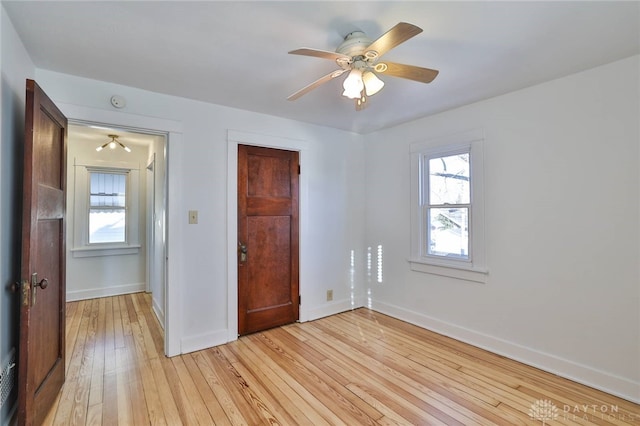 unfurnished bedroom featuring ceiling fan and light wood-type flooring