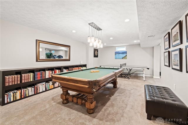 game room featuring pool table, carpet floors, and a textured ceiling