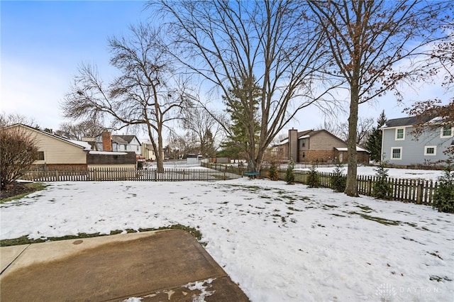 view of yard layered in snow